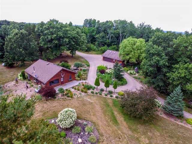 central Wisconsin home, garage, and garden from drone POV